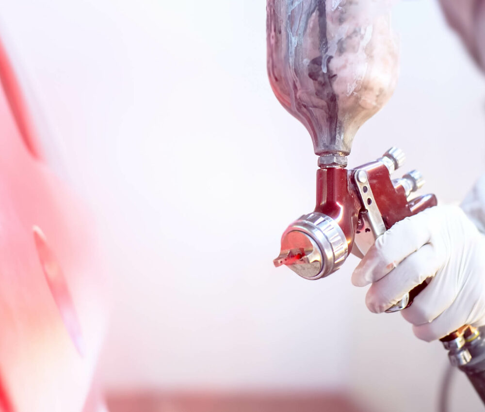 Hands of car mechanic in auto repair service with wrench